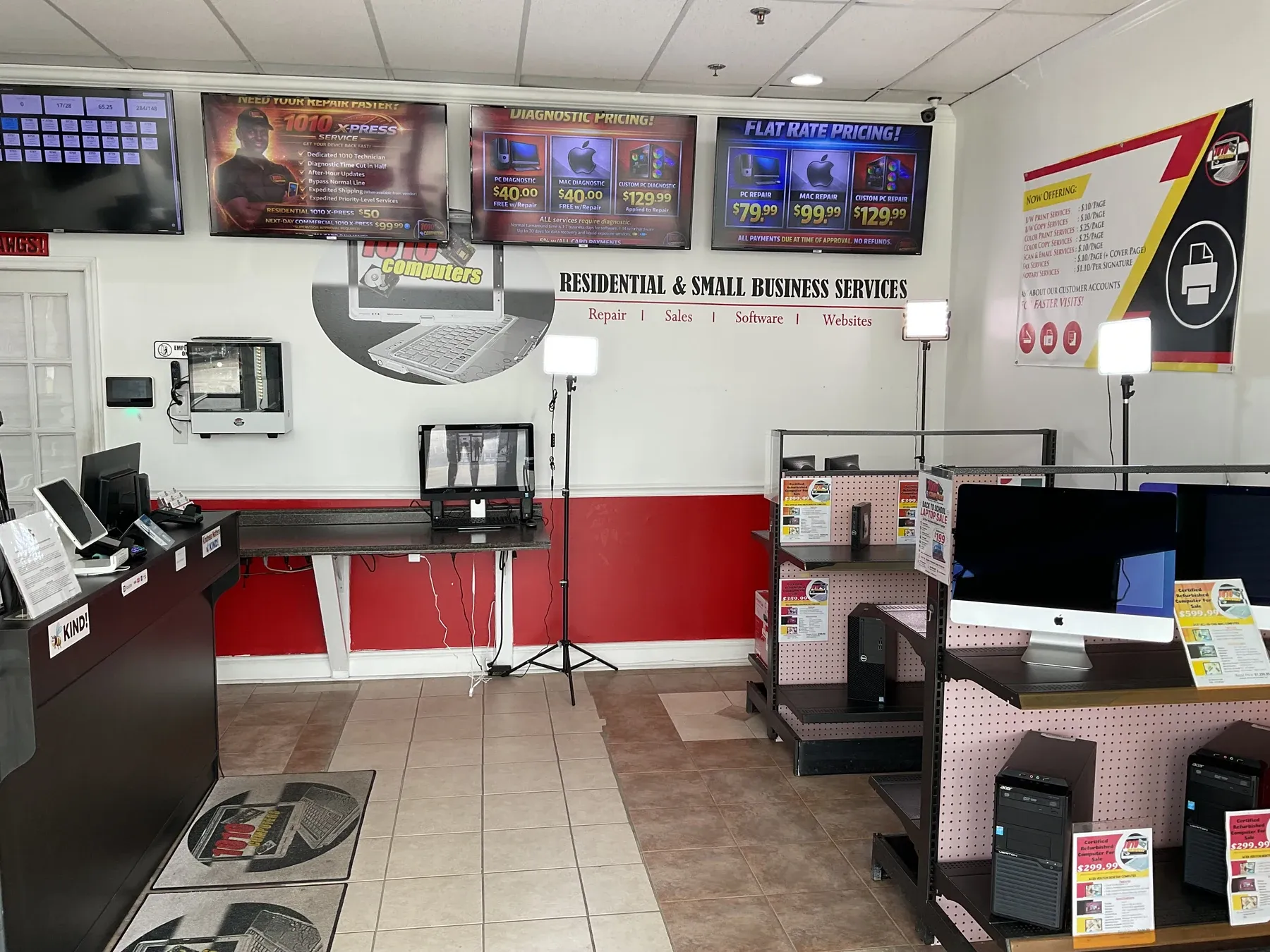 Inside the 1010Computers McDonough repair center with the service counter and computers displayed for sale
